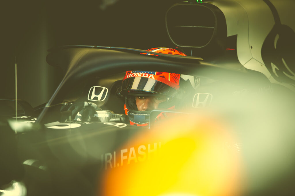 Piere Gasly - Alpha Tauri Shakedown Imola 2021 - Portrait of him being sitting in the Formula Car that is parked in the garage