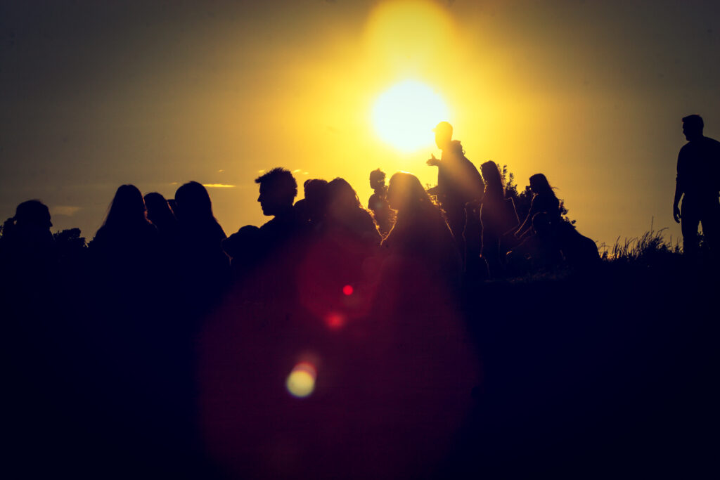 Primrose Hill London, UK - Group of people at sun-set