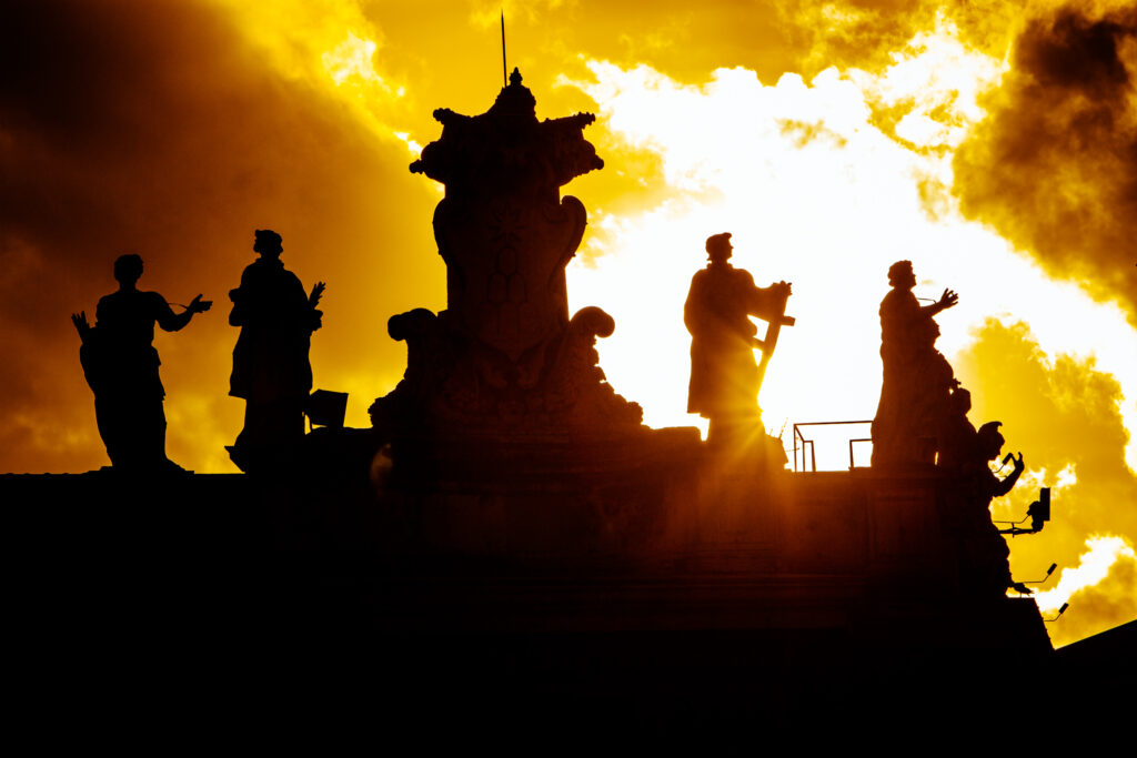 Sunset view of Statues on the building of the Vatican in Rome